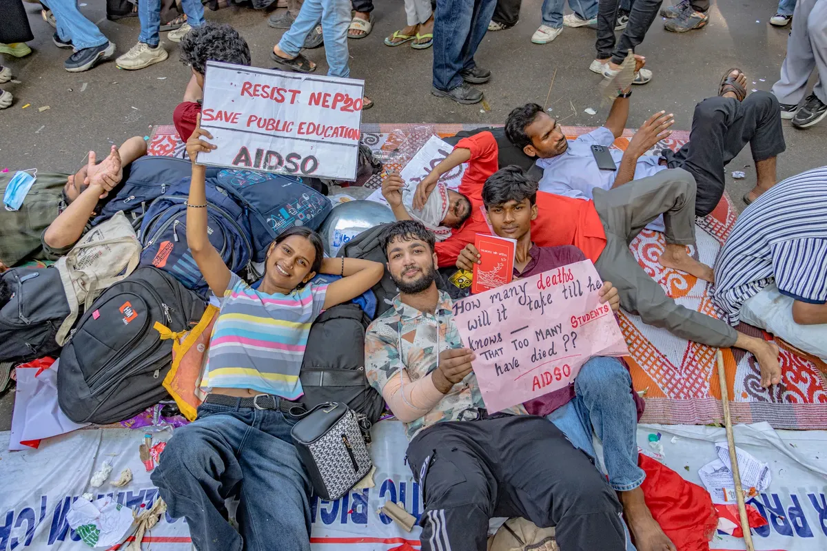 Students at a peaceful protest in New Delhi, advocating for public education rights.